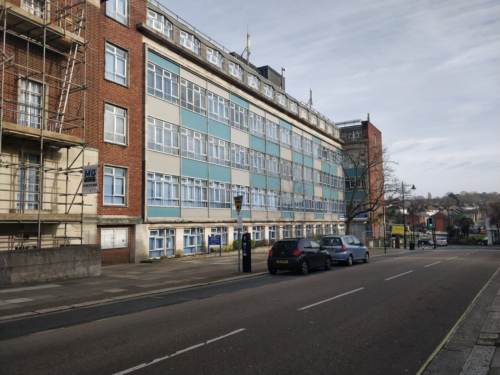 A row of commercial buildings and offices on a town street