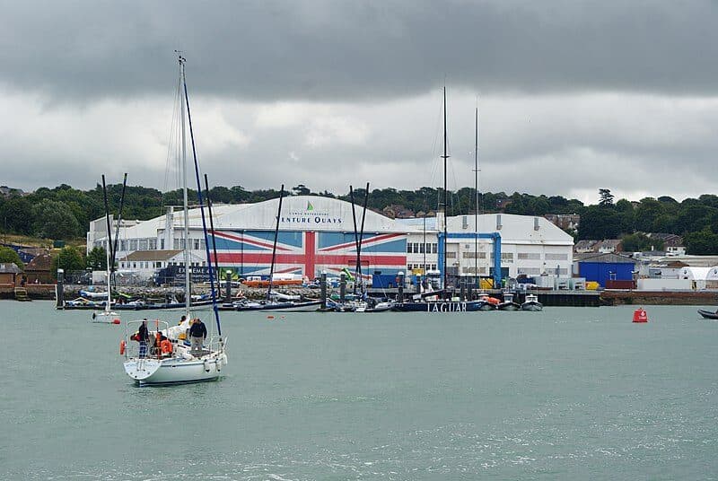 Yachts on the Medina at East Cowes, with the Union Flag hangar door behind