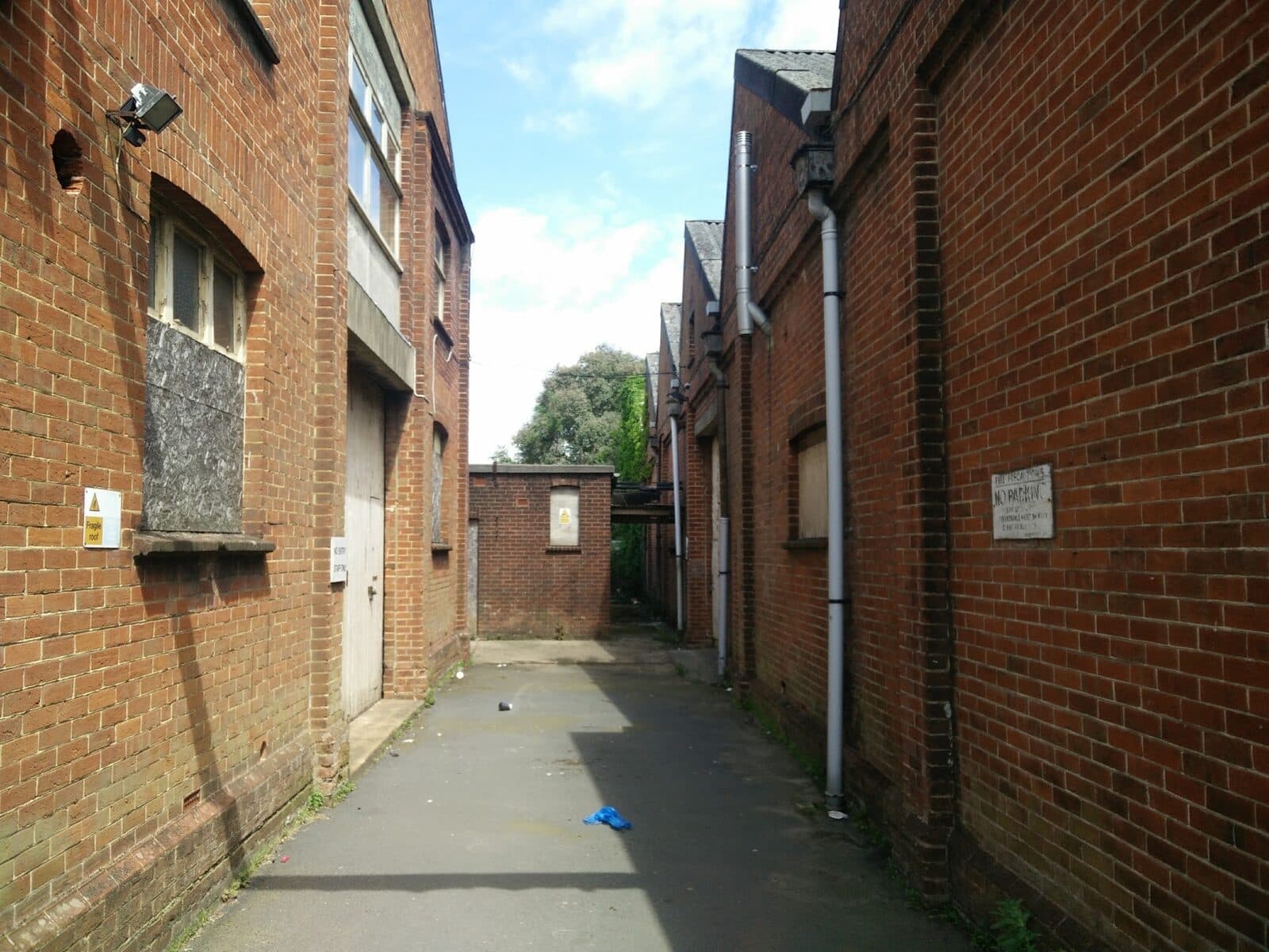 The service alley behind a row of shops